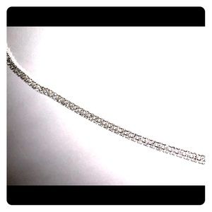 Double rows of CZ on a silver choker.